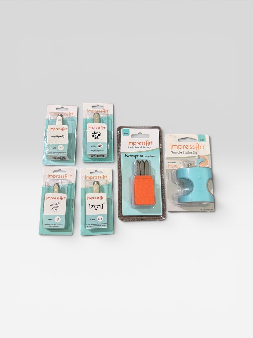 imPRESS Metal Stamping Craft Set with Teal Pieces and Orange Accent